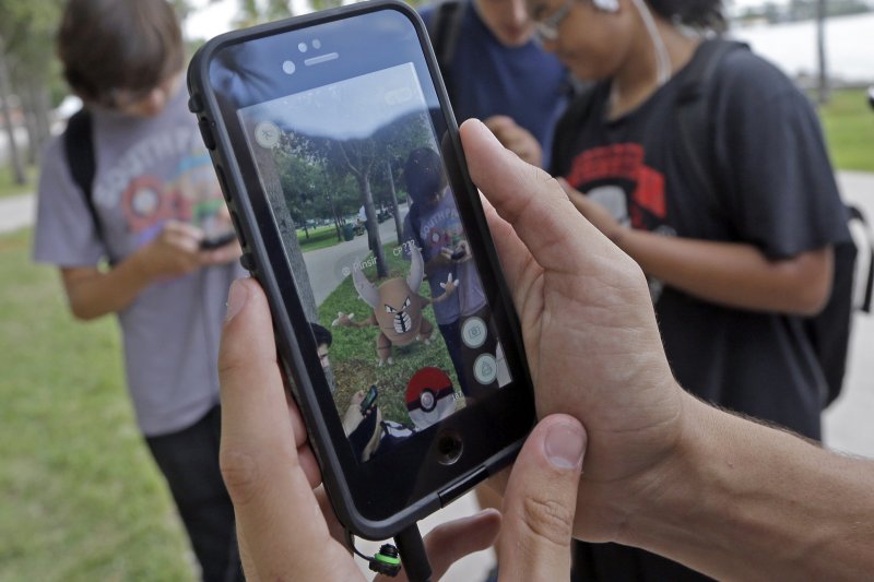日本任天堂手機遊戲「精靈寶可夢GO」(Pokémon GO)風靡全球(美聯社) 日本任天堂手機遊戲「精靈寶可夢GO」(Pokémon GO)風靡全球(美聯社)