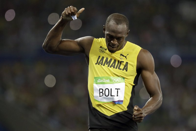 短跑名將「牙買加閃電」博爾特(Usain Bolt)摘下奧運男子200公尺短跑金牌(美聯社) 短跑名將「牙買加閃電」博爾特(Usain Bolt)摘下奧運男子200公尺短跑金牌(美聯社)