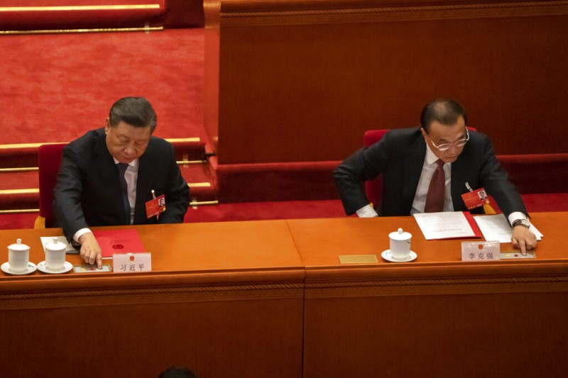 2022年3月,全國人民代表大會上的習近平與李克強。(美聯社) 2022年3月,全國人民代表大會上的習近平與李克強。(美聯社)