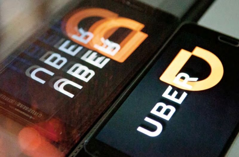 滴滴出行（Didi Chuxing）與優步（Uber Technologies）全球達成戰略協議。（來源：東方IC／多維提供）