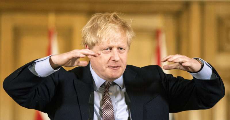 英國首相強森16日召開防疫對策記者會。(美聯社) 英國首相強森16日召開防疫對策記者會。(美聯社)